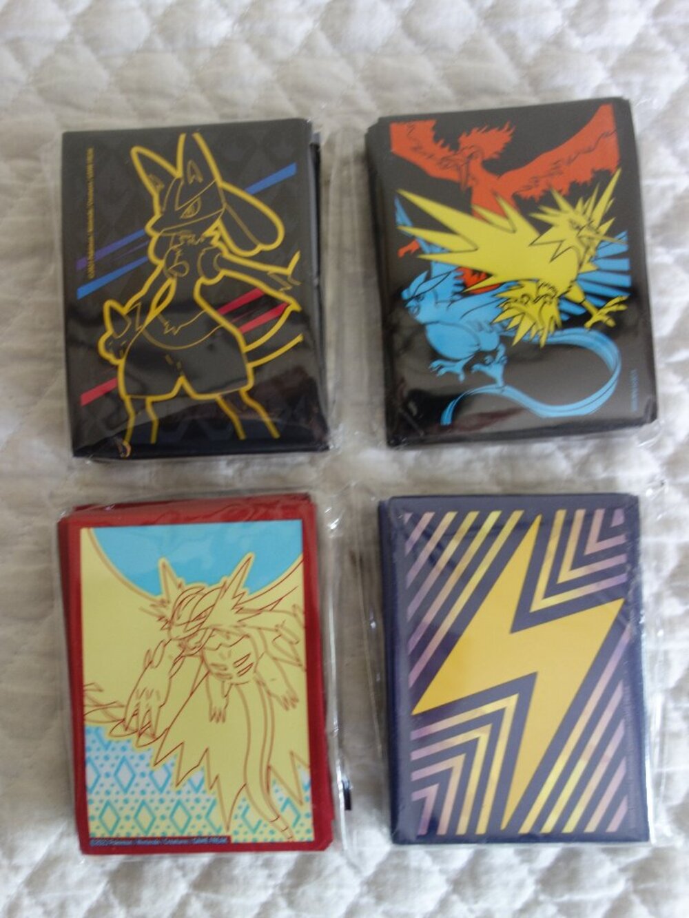 (a)	Lot of 4 NIP 65 count ea POKEMAN Trading Card Sleeves